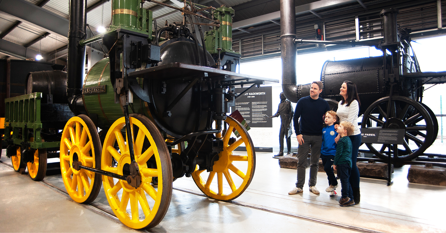 family looking at historic engine at Locomotion, Shildon